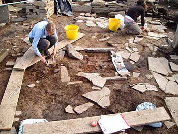 Rosie reveals the full extent of the hearth in Structure 1. Rosie reveals the full extent of the hearth in Structure 1.