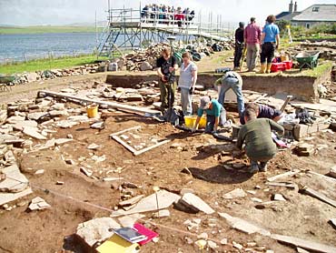 Removal-of-the-central-baulk-across-St-14-reveals-the-rest-of-the-second-hearth Removal of the central baulk across St 14 reveals the rest of the second hearth.
